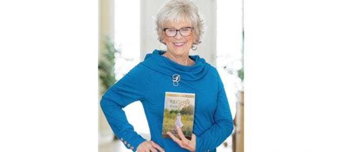 Author Dar Geiger with her new book, Reignite Your Joy